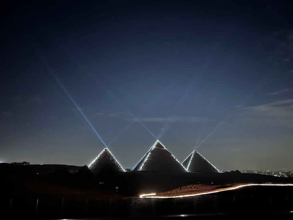 About us 14 Giza Pyramids and Great Sphinx illuminated at night during the spectacular Sound and Light Show in Cairo