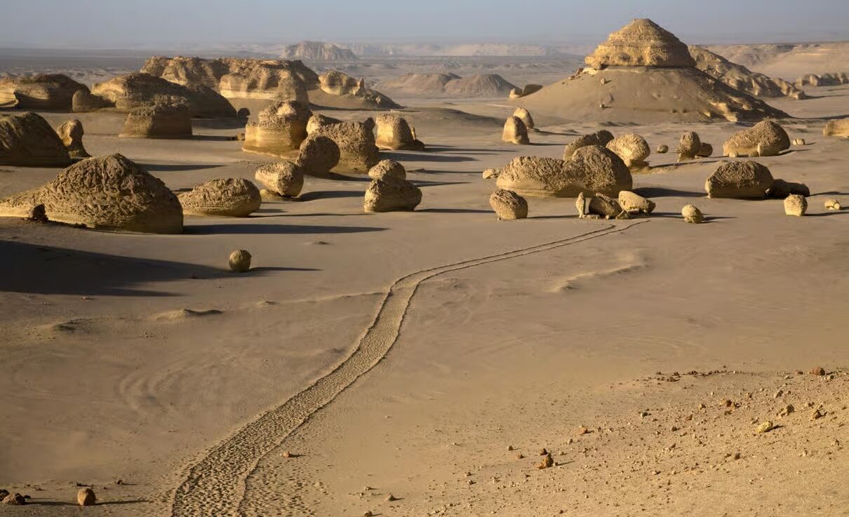 Fayoum Day Trip from Cairo: Magic Lake, Wadi El Rayan & Tunis Village 1 Fayoum Egypt landscape with Magic Lake, Wadi El Rayan waterfalls, desert mountains and Tunis Village scenery