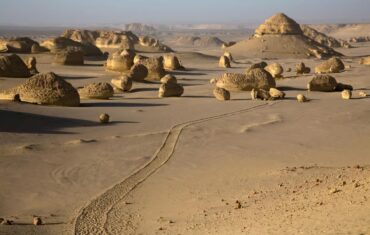 Fayoum Egypt landscape with Magic Lake, Wadi El Rayan waterfalls, desert mountains and Tunis Village scenery