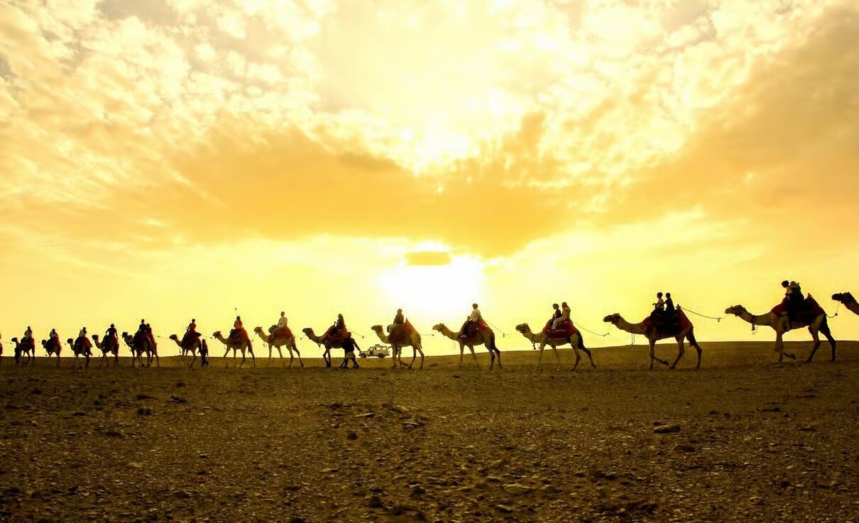 Hurghada desert at sunset with Bedouin camp, mountains and clear Egyptian night sky