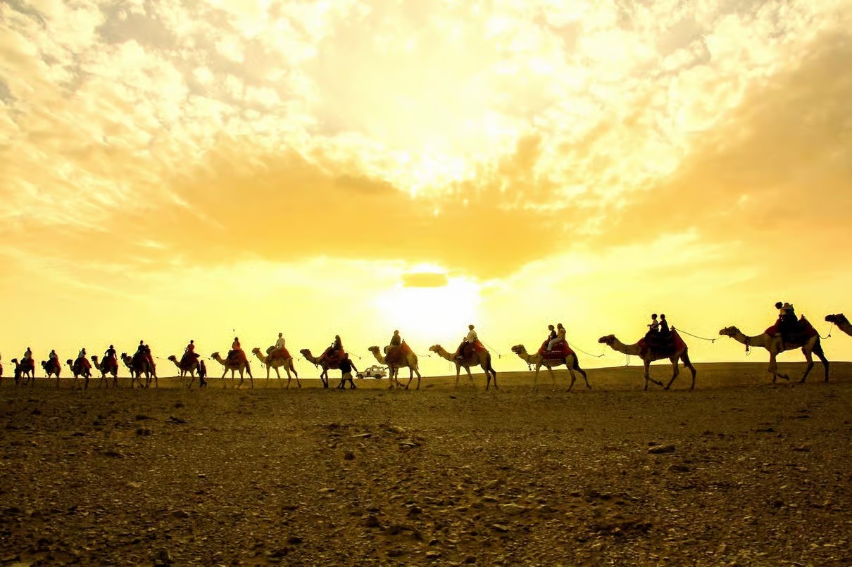 Hurghada desert at sunset with Bedouin camp, mountains and clear Egyptian night sky