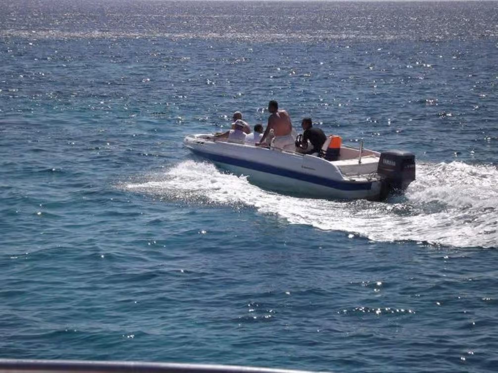 Tiran Island near Sharm El Sheikh with turquoise Red Sea waters, coral reefs and beautiful coastal scenery