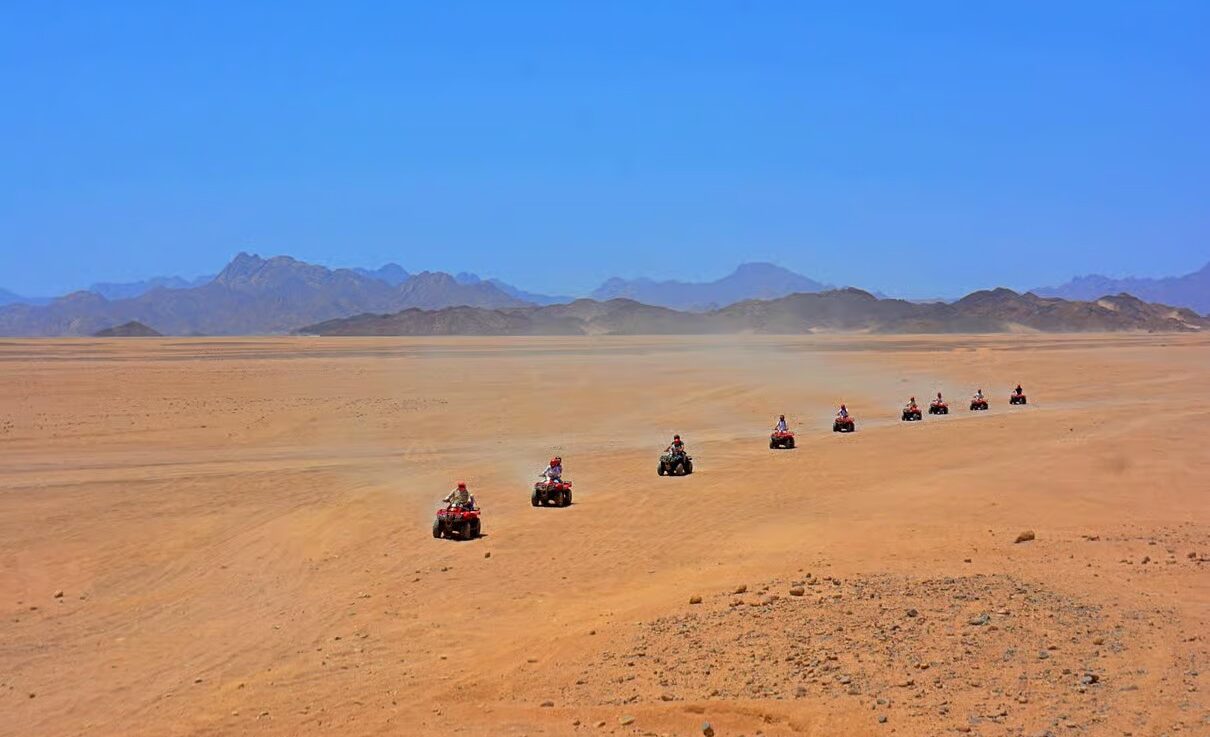 Hurghada desert safari at sunset with golden sand dunes and beautiful Egyptian desert landscapes