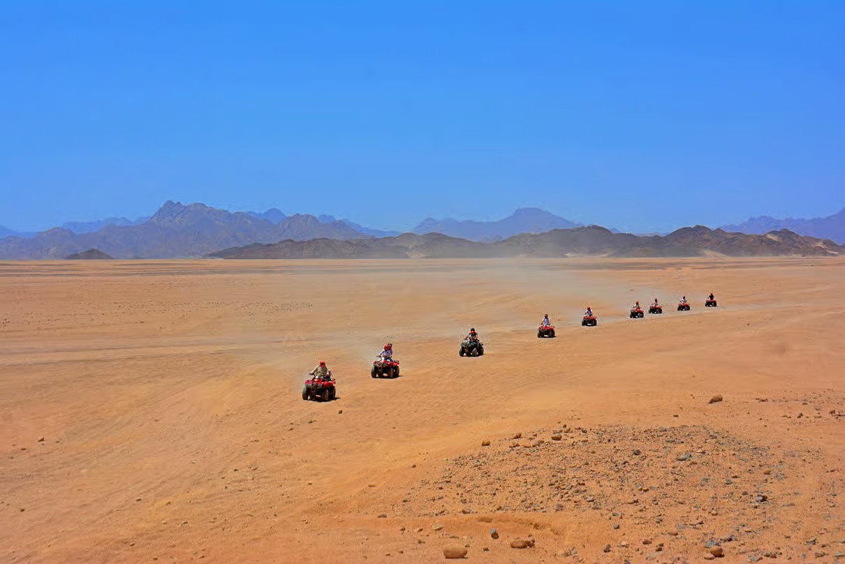 Hurghada desert safari at sunset with golden sand dunes and beautiful Egyptian desert landscapes