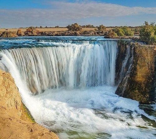 Wadi El Hitan and Wadi El Rayan Waterfalls Day Tour from Cairo, exploring whale fossils, desert landscapes, sand dunes, and Fayoum’s natural wonders.