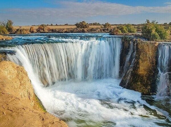 Wadi El Hitan and Wadi El Rayan Waterfalls Day Tour from Cairo, exploring whale fossils, desert landscapes, sand dunes, and Fayoum’s natural wonders.