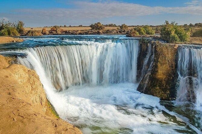 Wadi El Hitan and Wadi El Rayan Waterfalls Day Tour from Cairo, exploring whale fossils, desert landscapes, sand dunes, and Fayoum’s natural wonders.